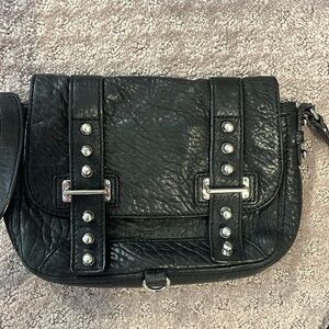 Black buckle Rebecca minkoff cross body bag. Slightly used
